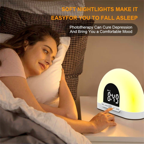 Electronic alarm clock with simulated sunrise lamp